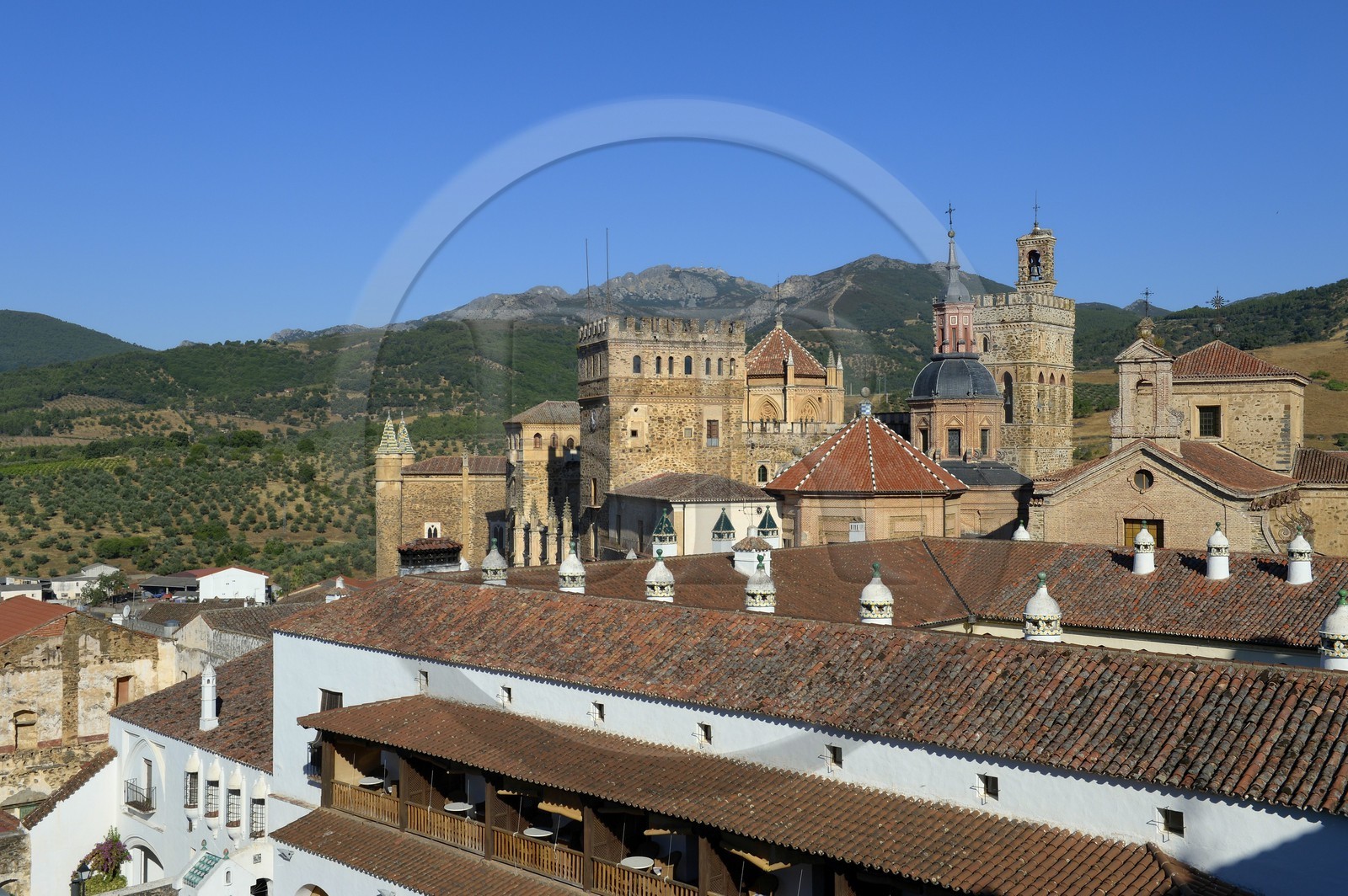 Spain, Extremadura, Guadalupe, Royal Monastery of Santa Maria de Guadalupe listed as World Heritage by UNESCO and the Parador of Tourism former Saint John the Baptist Hospital (San Juan Bautista hospital) in the foreground