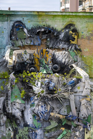 Portugal, Lisbon, Belem, a 4 m high bas-relief by the artist Bordalo II, a raccoon assembled from old tires, bumpers and electronic components, it faces the Belém MAC CCB Cultural Center
