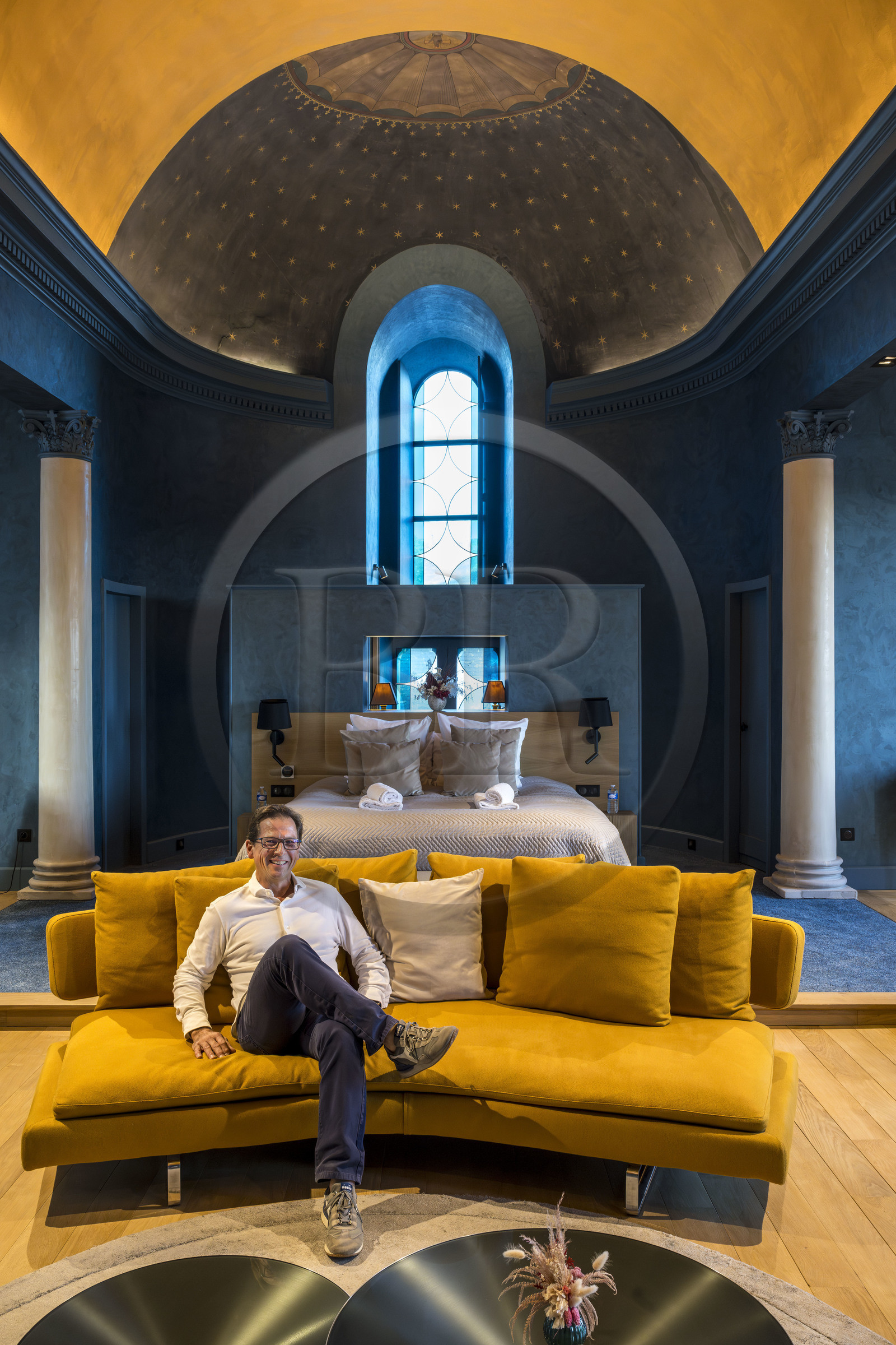 France, Nièvre, Nevers, Philippe Paillard creator of Les Suites du Palais, four high-end apartments located in the former diocesan buildings, the Chapel apartment, a blue and designer cocoon with a breathtaking view of the cathedral