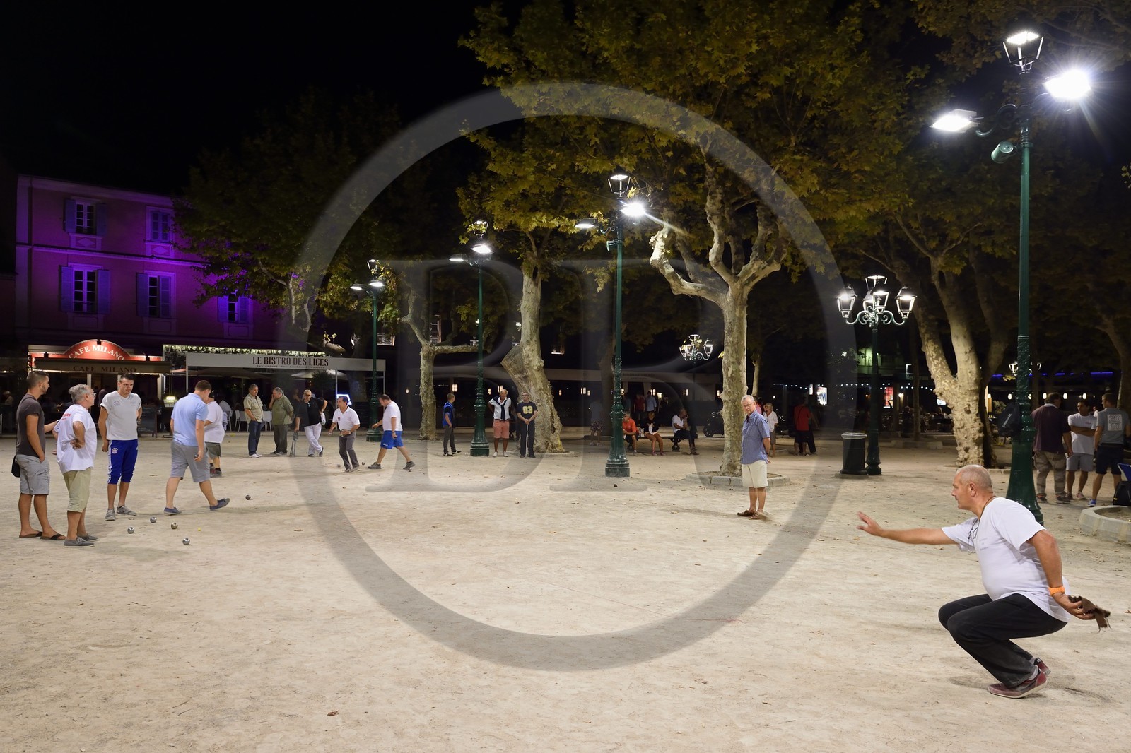 France, Var, Saint-Tropez, petanque players on the Place des Lices at night