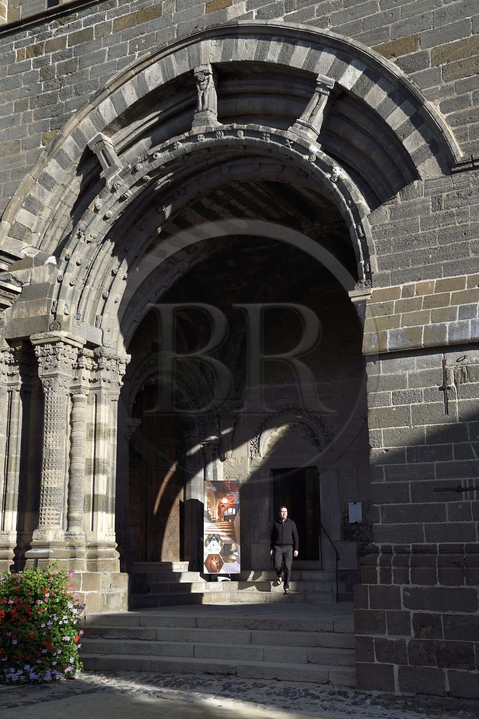 France, Haute Loire, Le Puy en Velay, Routes of Santiago de Compostela, the 12th century Our Lady (Notre-Dame-de-l'Annunciation) cathedral listed as World heritage by UNESCO, Father Nicolas Pourrat, chaplain of the cathedral, under the For porch
