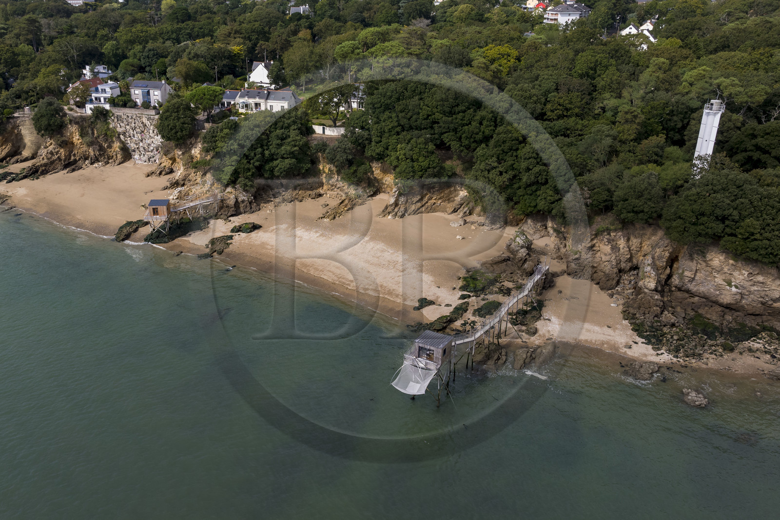 France, Loire Atlantique, Estuaire de la Loire, Saint Nazaire, the Feu de Porcé (lighthouse) along the GR 34 long-distance trail, alignment lights which serve to mark the maritime channel allowing entry into the Loire estuary and  traditional carrelet (fishing shack) on the beach