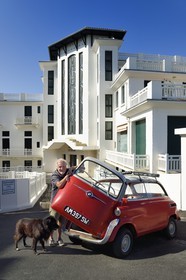 France, Pyrenees Atlantiques, Basque Country coast, Guethary, former art deco Guétharia hotel built in the 1920s turned into a residence, French journalist, writer and director Alain Gardinier driving his BMW Isetta