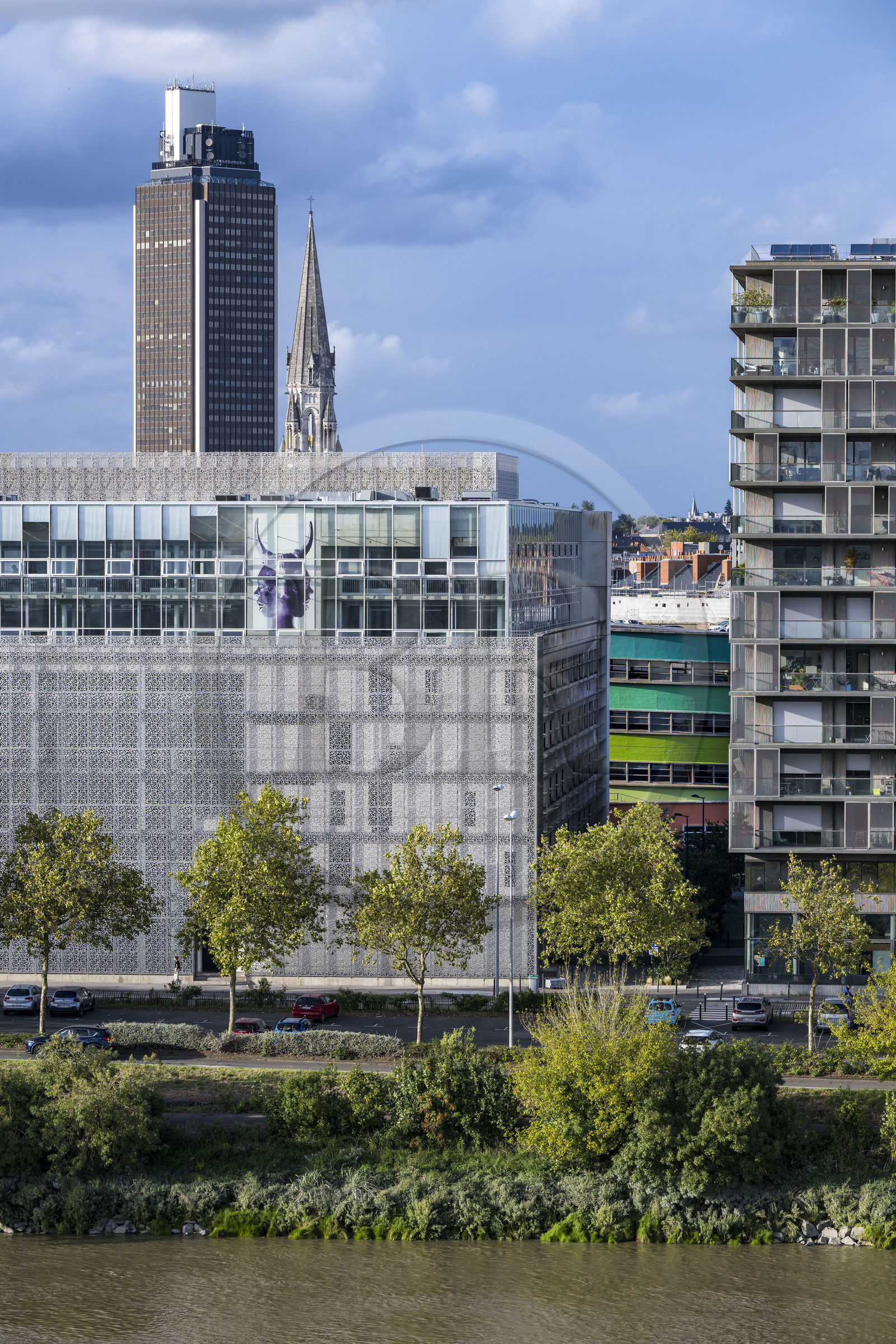 France, Loire Atlantique, Nantes, work of the artist Orlan displayed at the top of the building on Quai André Morice and the rue Bias car park revisited by the work Extensions (2022) by the artist Krijn de Koning for Le Voyage à Nantes, the Tour de Bretagne in the background