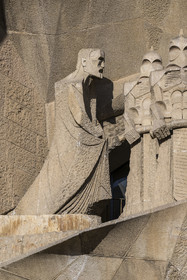 Spain, Catalonia, Barcelona, Eixample district, Sagrada Familia basilica by Catalan modernist architect Antoni Gaudi, listed as a UNESCO World Heritage Site, Gaudi (left) embodied in the figure of an evangelist by the sculptor Subirachs