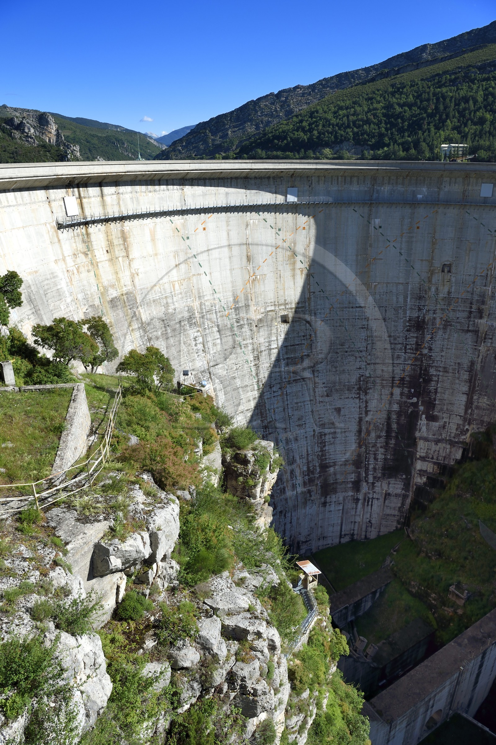 France, Alpes de Haute Provence, the lake of Castillon dam which retains the waters of the Verdon river, giant sundial on the 100 meters high wall