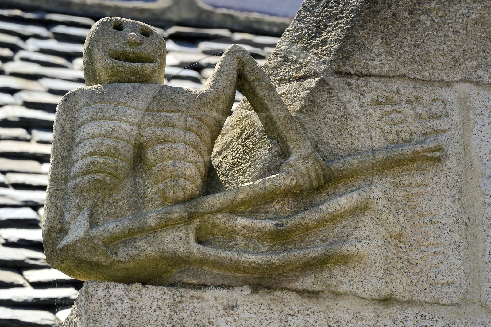 France, Finistere, Pleyben, statue of the Ankou (personification of death in Breton mythology) on the facade of a house