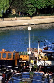 France, Paris, banks of the Seine river listed as World Heritage by UNESCO, barge on Conti quay