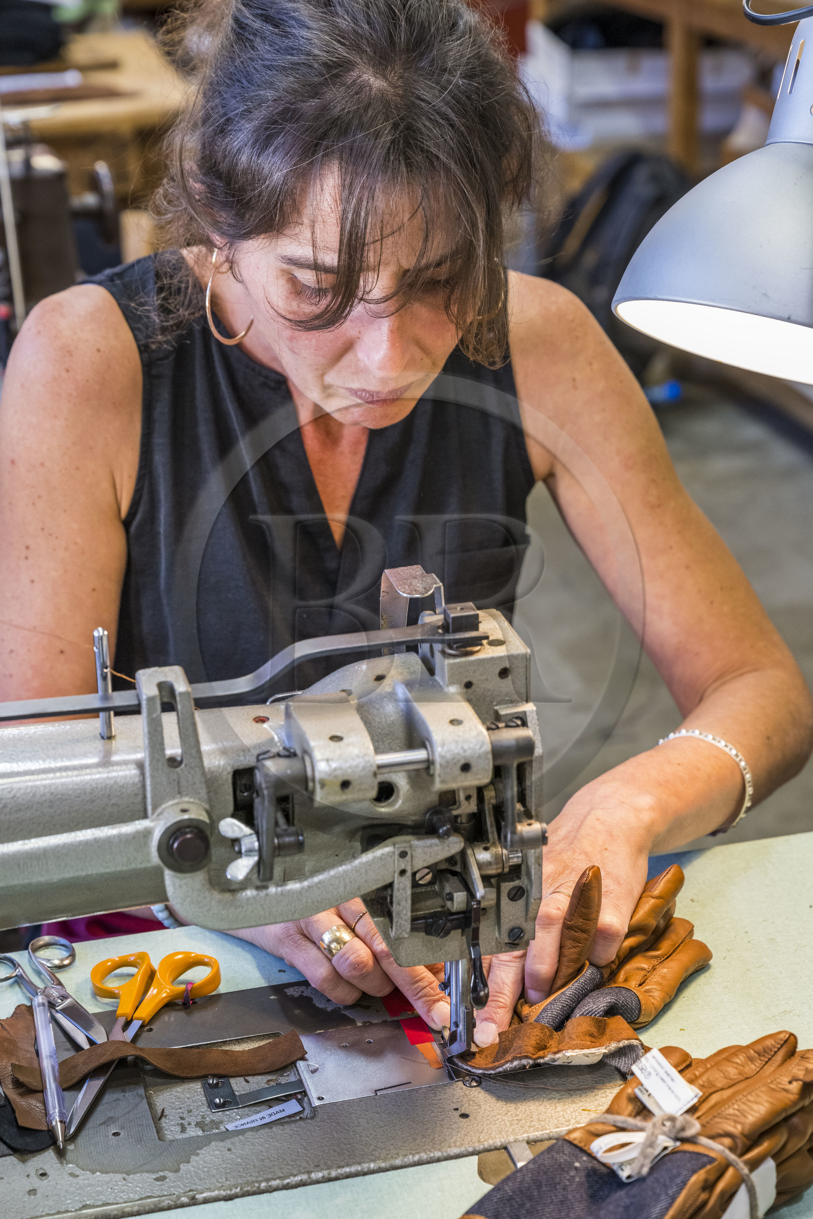 France, Aveyron, Millau, Maison Fabre (Ganterie Fabre), family glove factory founded in 1924, glove english sewing technique on old machines in the workshop