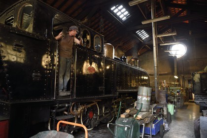 France, Alpes-Maritimes, Puget Theniers, the Train des Pignes, steam engine warming up in the maintenance workshop at the motive power depot