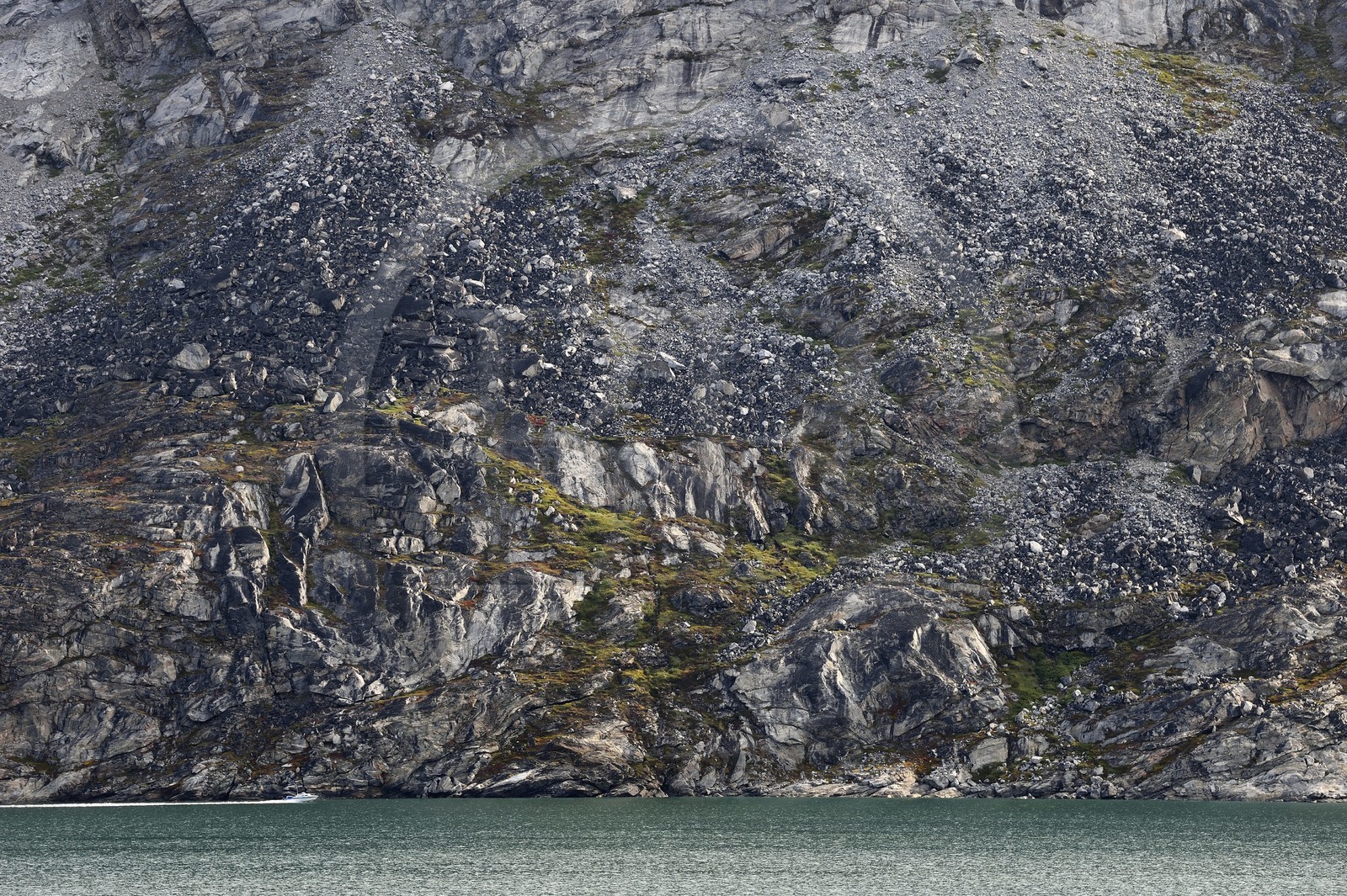 Greenland, west coast, Disko Bay, Ataa Strait, speedboat going up the strait of Ataa along the cliff