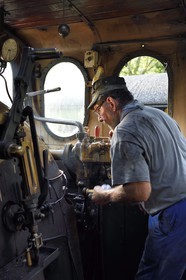 France, Alpes-Maritimes, Puget Theniers, steam engine warming up, in the cabin, Daniel Bonneau volunteer of G.E.C.P. that restores and operates the Train des Pignes, today engineer (and therefore train driver)
