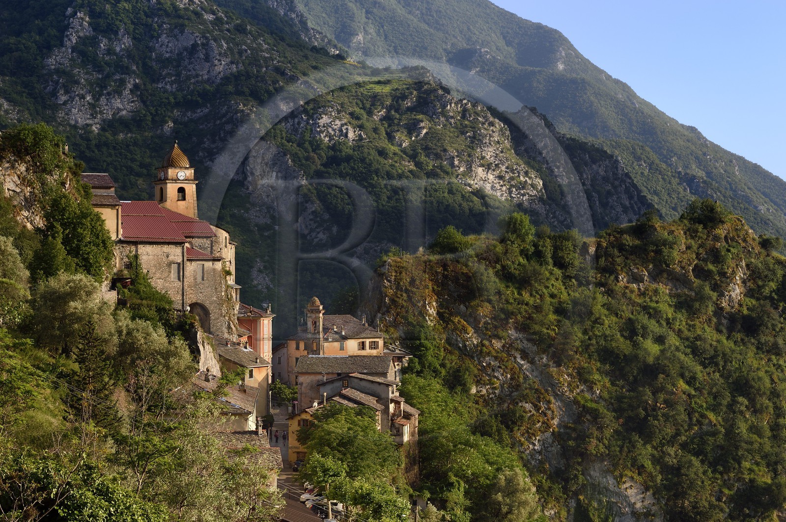 France, Alpes-Maritimes, Roya Valley (Nice hinterland), at the foot of the Mercantour National Park, perched village of Saorge, Saint-Sauveur (St. Saviour) church overlooks the valley