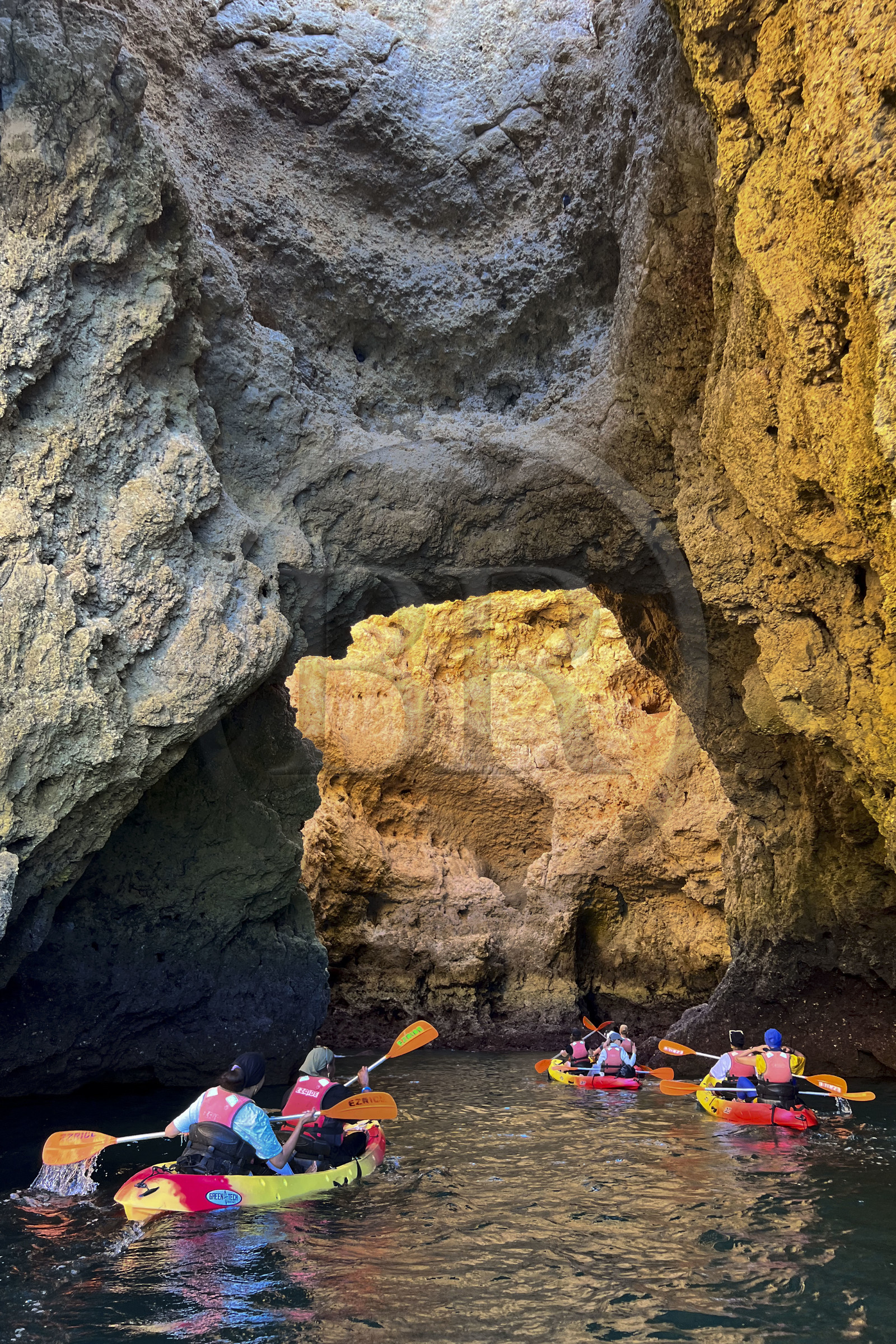 Portugal, Algarve, Lagos, Kayak tour at the foot of the steep cliffs of Ponta da Piedade
