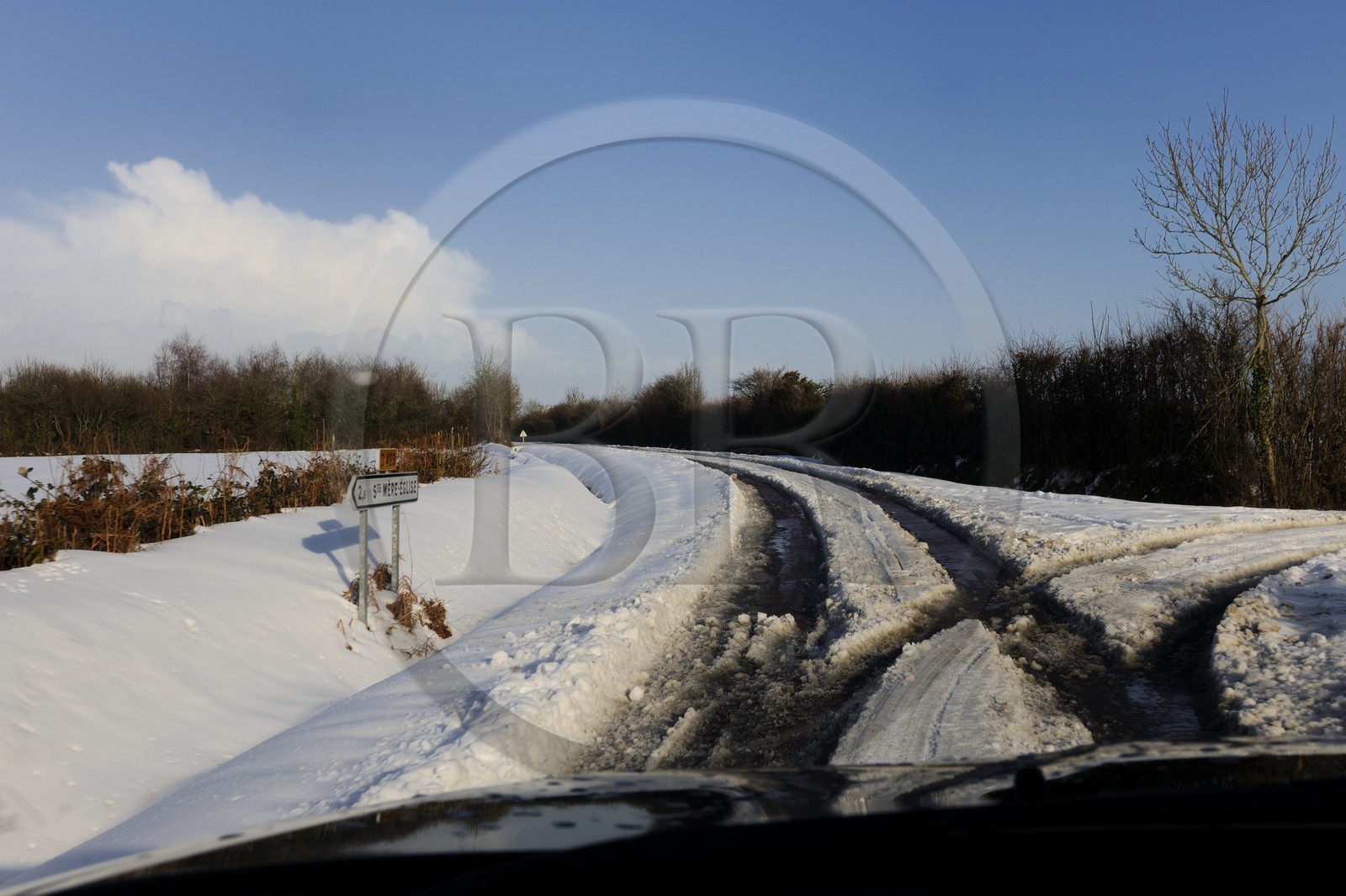France, Manche, Cotentin, Sainte Mere Eglise, snowy road