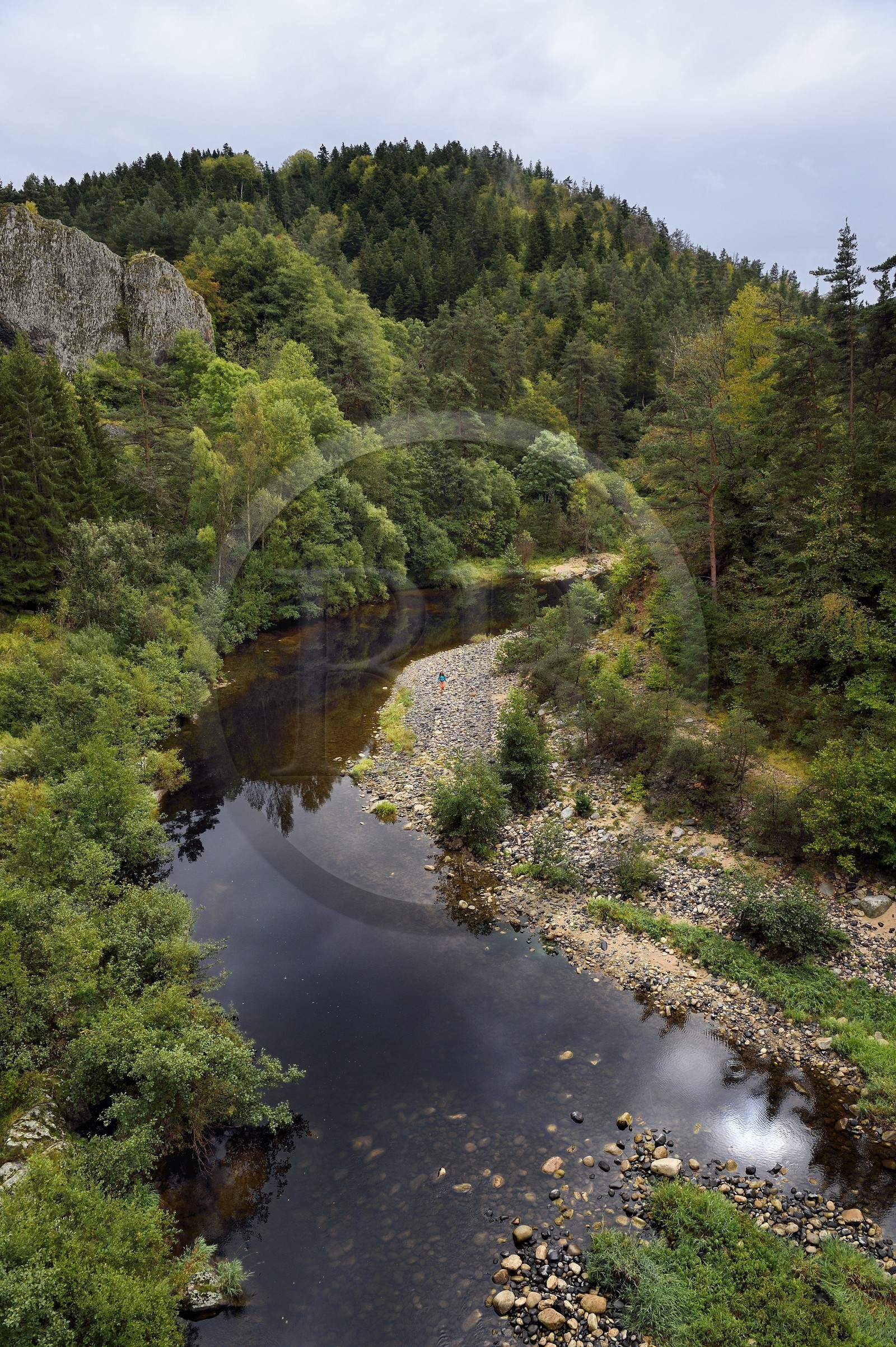 France, Haute Loire, Loire river Valley, Salettes, hiker along the banks of the Loire river at the Pont de Soubrey