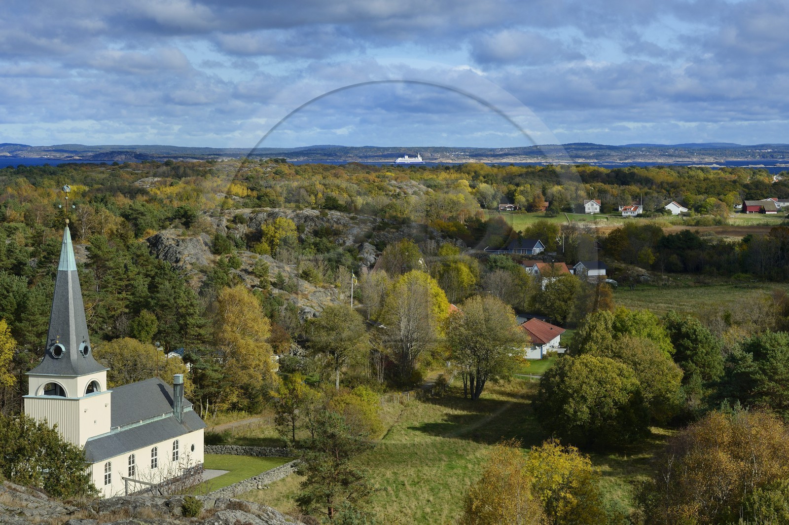 Sweden, Västra Götaland, Koster Islands, Sydkoster, the island church seen from the Valfjäll rock, Stromstad ferry and the mainland coast in the background