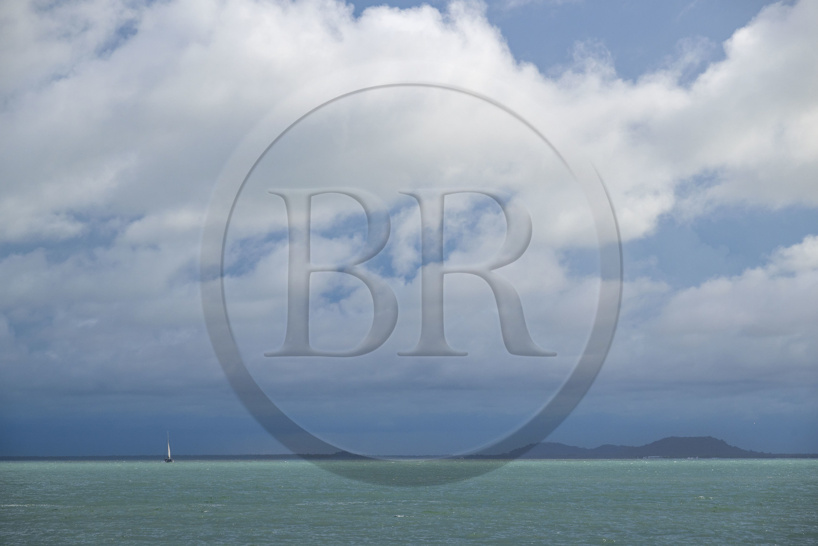 France, Guyane, Kourou, Iles du Salut, Ile Royale, catamaran au large des Iles du Salut par temps menacant