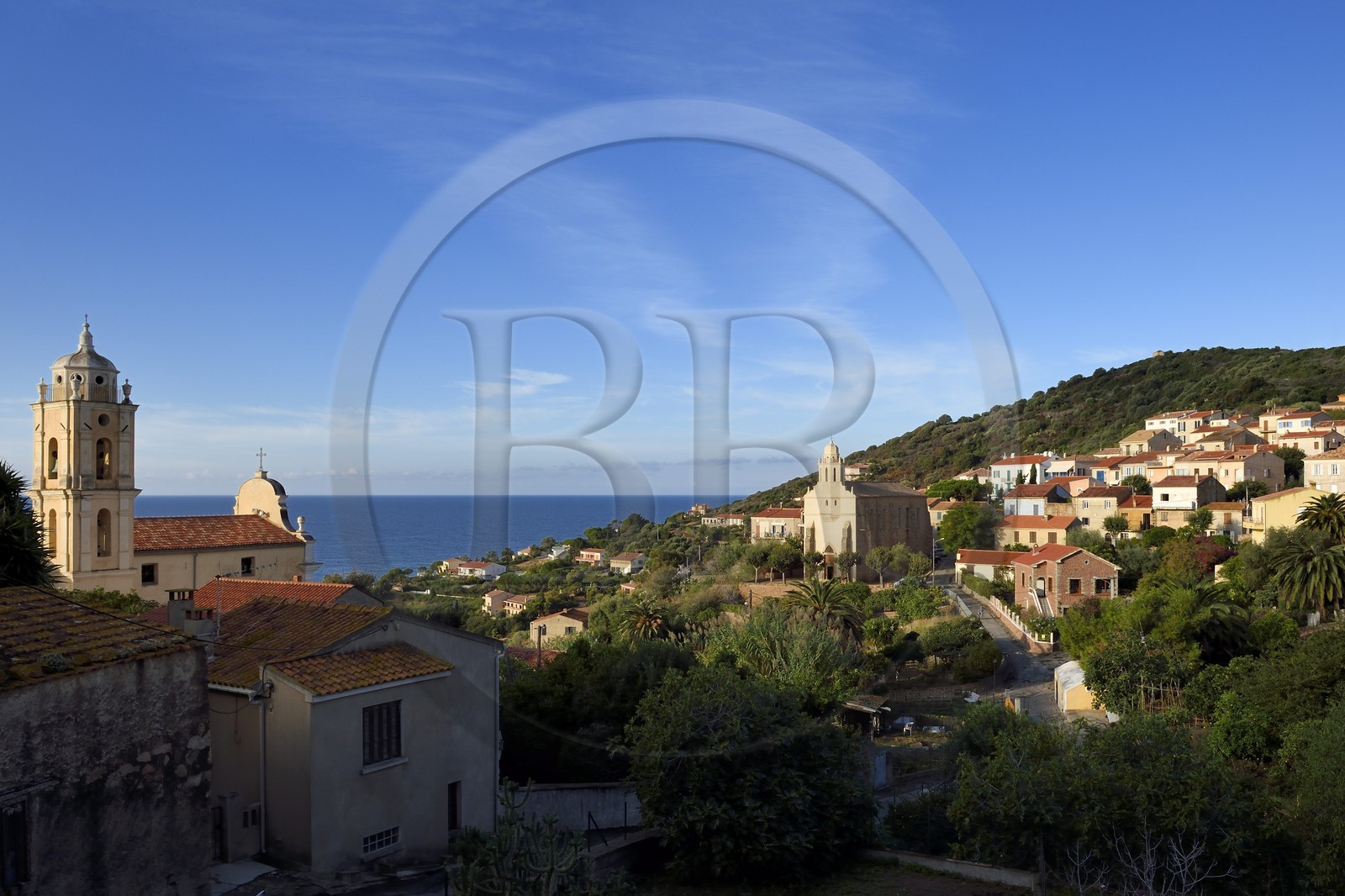 France, Corse du Sud, Cargese, the catholic church (latin rite)  in the foreground and the Greek catholic church of Saint Spyridon (Eastern rite or Uniate) in the background