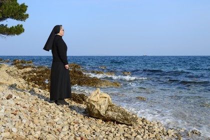 Croatia, Dalmatia, Dalmatian Coast, Ugljan Island, Franciscan St. Jerome Convent of the Congregation of the Sisters of Mercy, sister Theresija like contemplating the sea in her spare time