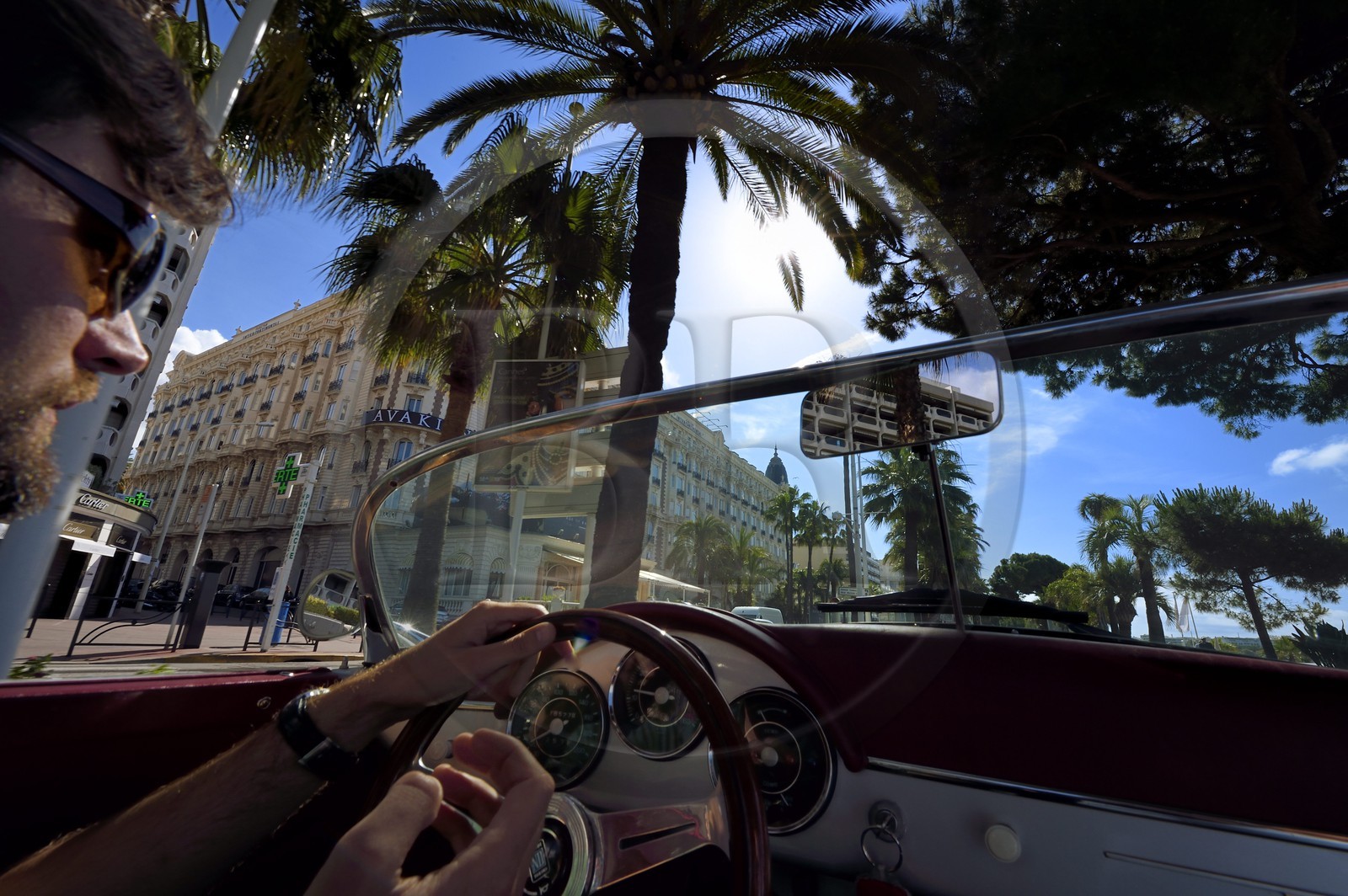 France, Alpes-Maritimes, Cannes, the Carlton palace on the boulevard de la Croisette, aboard a collection convertible Porsche Speedster 356