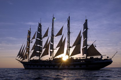 Caribbean sea, Saint Lucia island, the five masted ship SPV Royal Clipper with every sail set at sunset