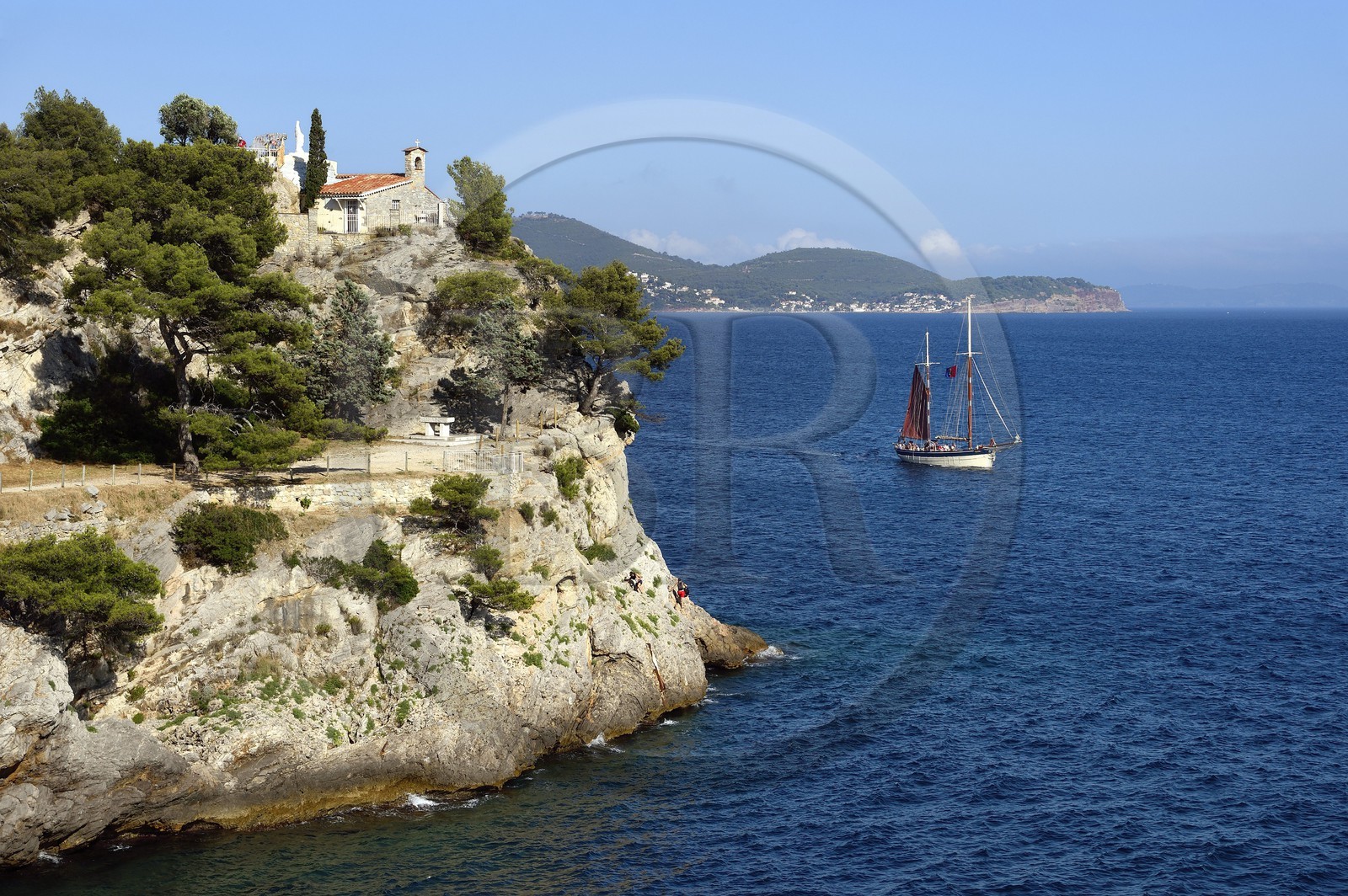 France, Var, the Rade (Roadstead) of Toulon, cap Brun, Statue of the Virgin Mary atop the chapel of Notre Dame du Cap Falcon and the Jld'a sailboat