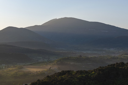 France, Vaucluse, Dentelles de Montmirail mountains, Crestet, the plain north of Malaucène at sunrise and Mont Ventoux in the background (aerial view)