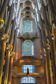 Spain, Catalonia, Barcelona, Eixample district, Sagrada Familia basilica by Catalan modernist architect Antoni Gaudi, listed as a UNESCO World Heritage Site, the bronze statue of Saint George (Sant Jordi) by the sculptor Subirachs in the center of the interior of the facade of Glory and the vault of the Nave at the top
