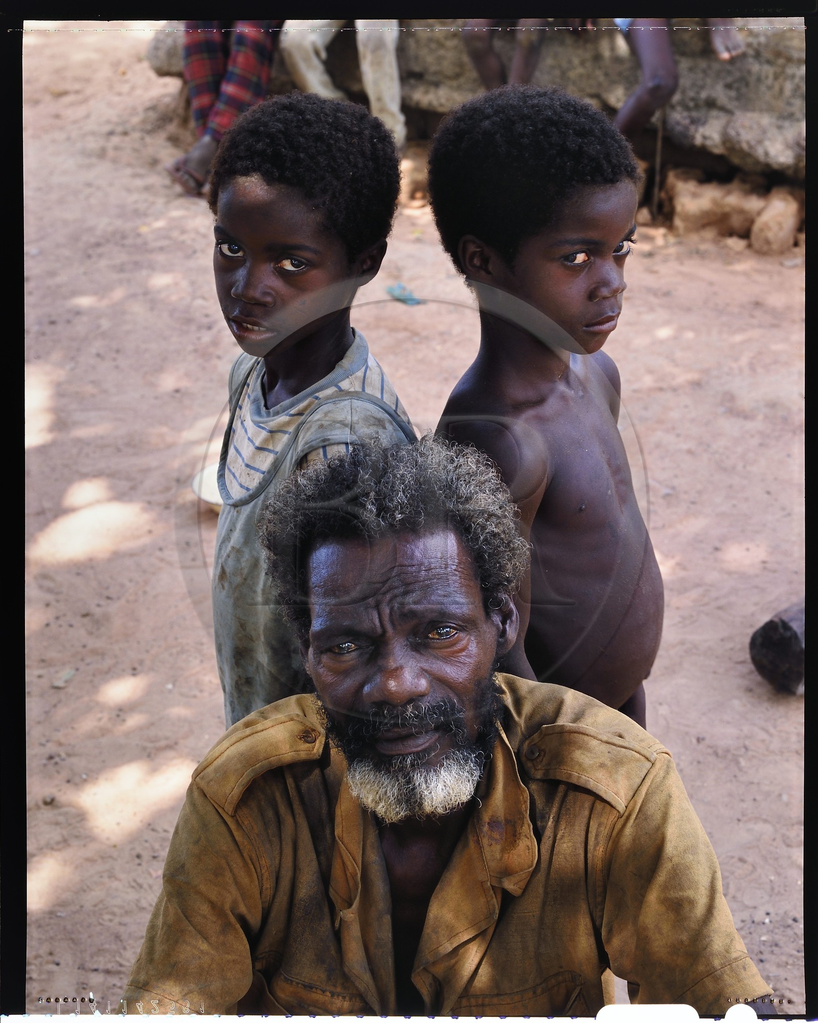 Burkina Faso, Poni province, Lobi land, Loropéni, Houliene Kambou with his little twin sons