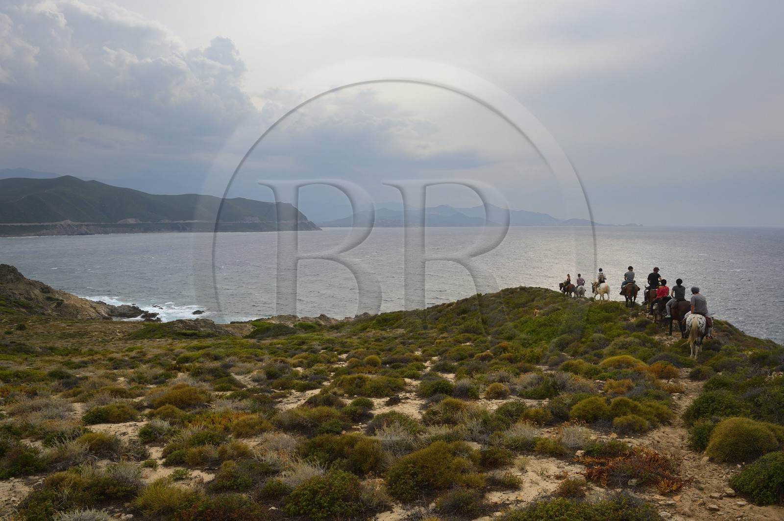 France, Haute Corse, Nebbio, Agriates Desert, Peraiola Cove, riders on the North-East of Ostriconi beach on the Punta di l’Acciolu (Acciola)
