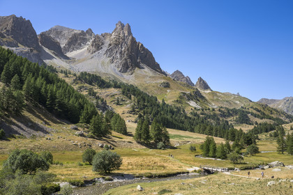 France, Hautes Alpes, Briancon region, Nevache, the Clarée valley, the Clarée river at the Moutet bridge, the Cerces massif and the peaks of the Main de Crépin (2942m) in the background