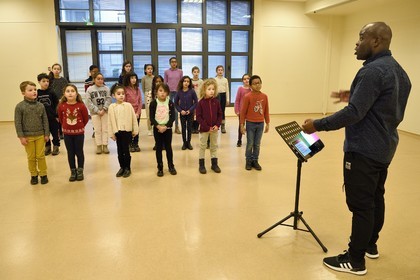 France, Bas Rhin, Strasbourg, old town listed as World Heritage by UNESCO, rehearsal of the Gospel Kids choir under the direction of choir master Alfonso Nsangu