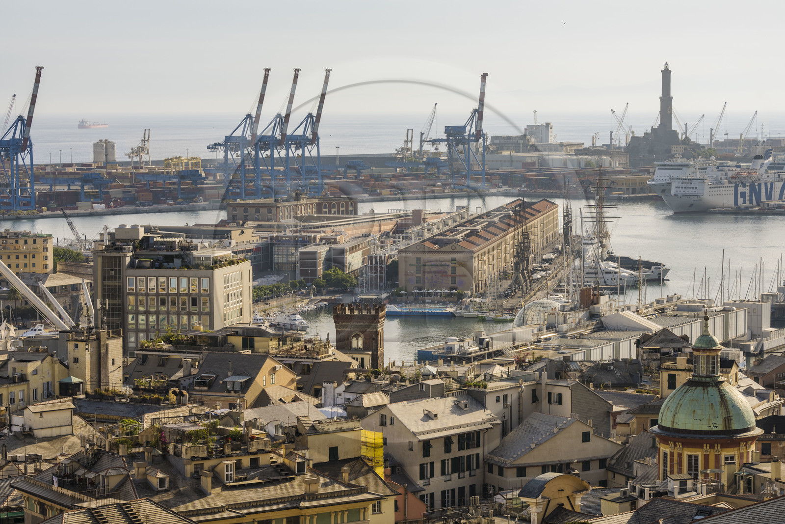 Italy, Liguria, Genoa, the Porto Antico (Old Port) seen from from the Belvedere of Castelletto, the commercial port in the background dominated by the Lanterna lighthouse