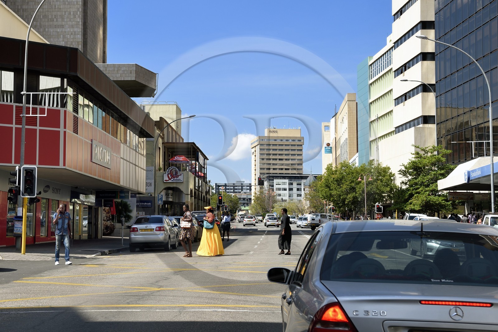 Namibia, Khomas region, Windhoek, Damara woman crossing Independence Avenue