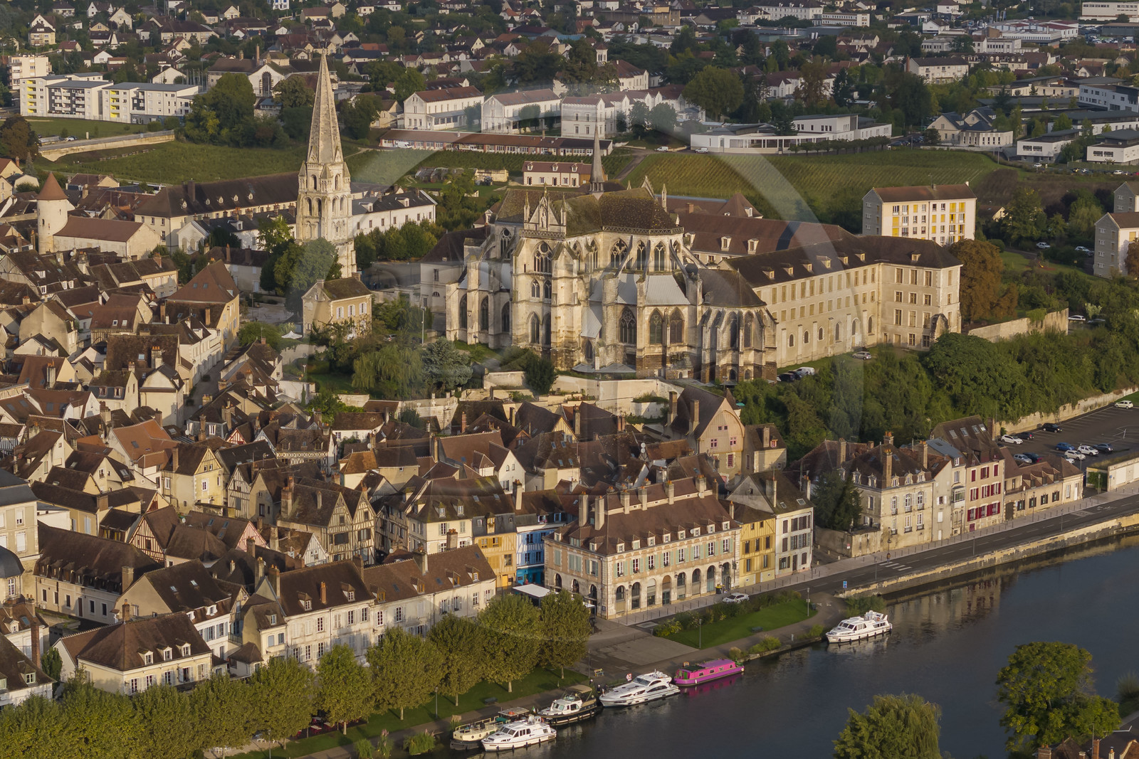 France, Yonne, Auxerre, Saint Germain Abbey overlooking the Marine district and the Green belt cycle path along the Yonne on the quay along the port (aerial view)