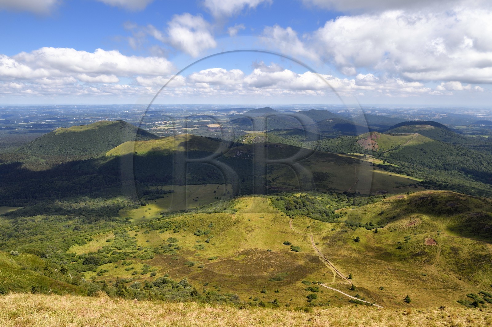 France, Puy de Dome, Parc Naturel Régional des Volcans d'Auvergne (regional nature park of Auvergne volcanoes), the northern part of the Chaine des Puys listed as World heritage by UNESCO, the path leading to the Traversin and the Puy Pariou crater on the right, in the background on the left the Puy de Côme