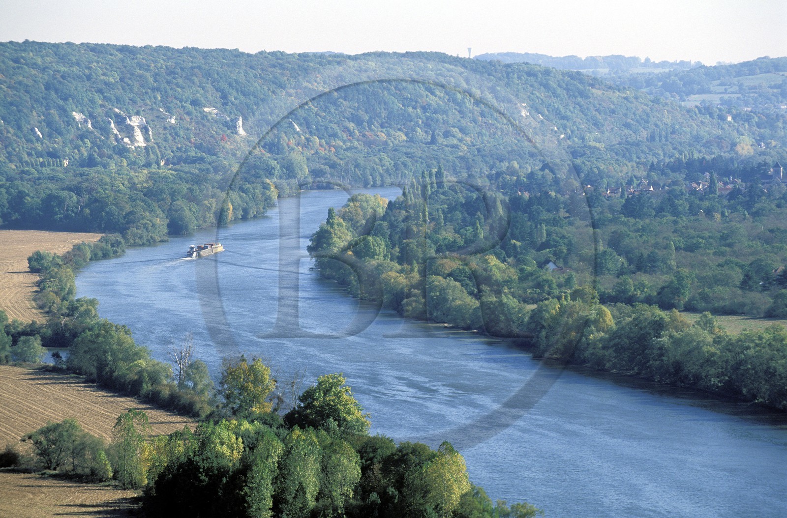 France, Val d' Oise, French Vexin Natural Regional Park, barge on the Seine river next to the limestone cliffs of La Roche Guyon