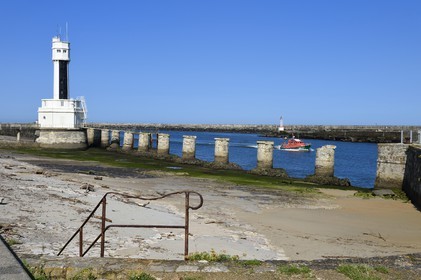 France, Pyrenees Atlantiques, Basque Country, Anglet, mouth of the Adour river, access to the sea for the port of Bayonne, the lighthouse and the boat of the National Society of Sea Rescue