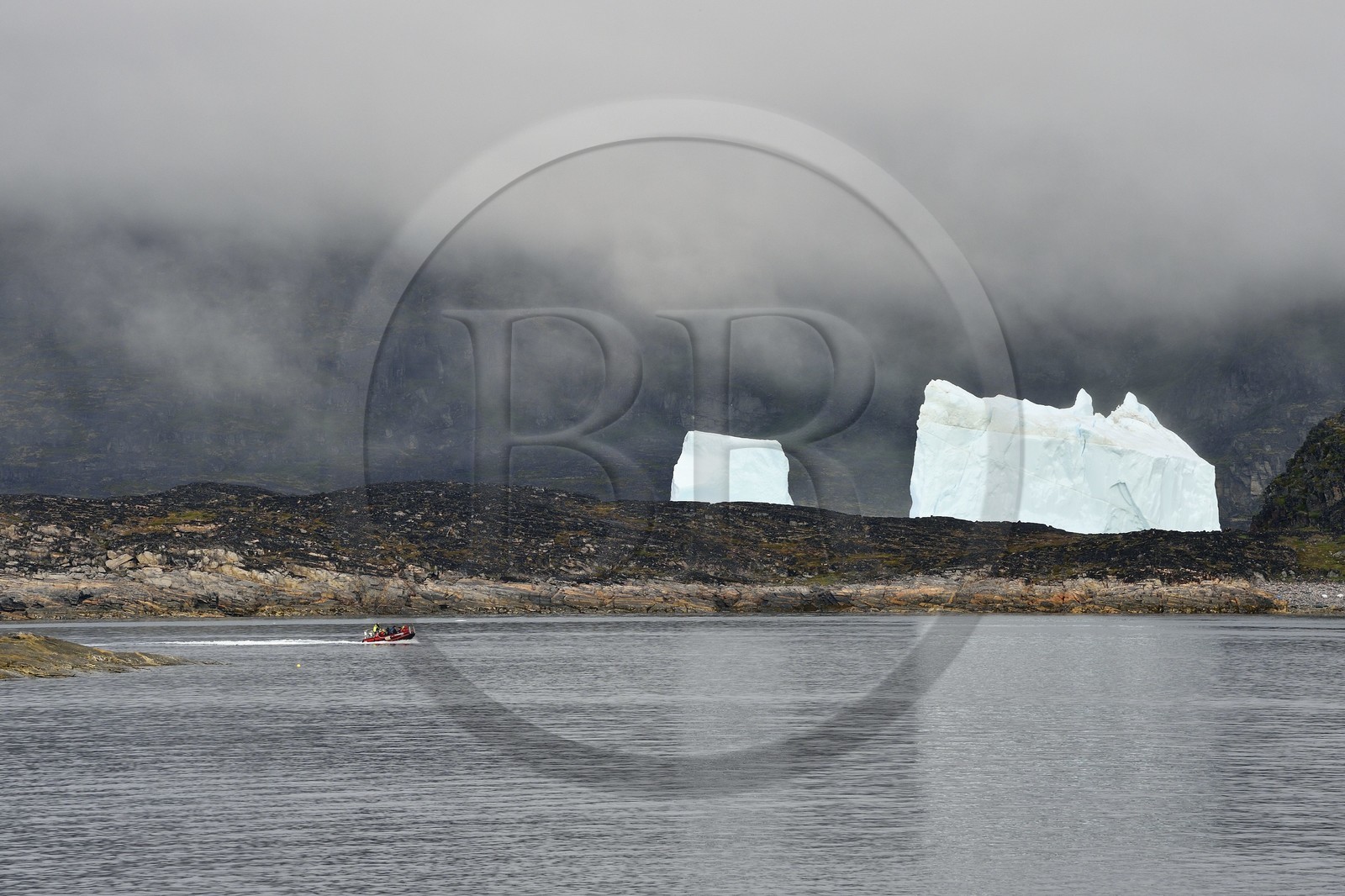 Greenland, west coast, Disko Island, Qeqertarsuaq village bay, icebergs in the mist