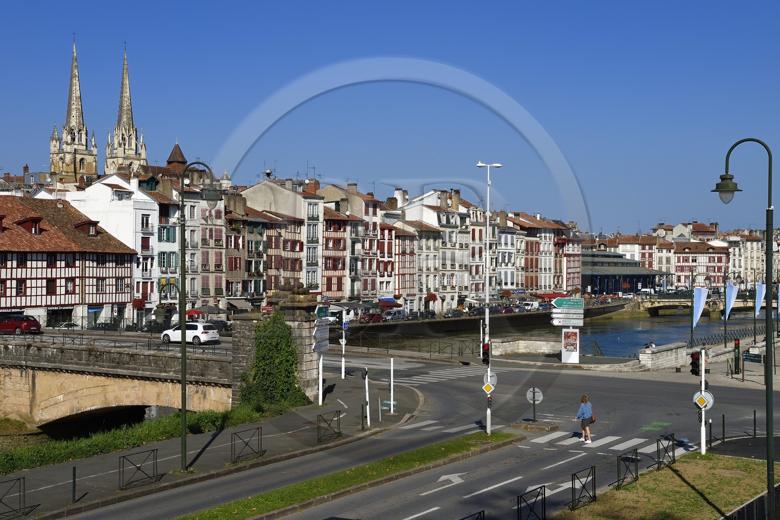 France, Pyrenees Atlantiques, Basque Country, Bayonne, the Nive river banks, the spires of St. Catherine's Cathedral behind the Jaureguiberry wharf and the covered market les Halles