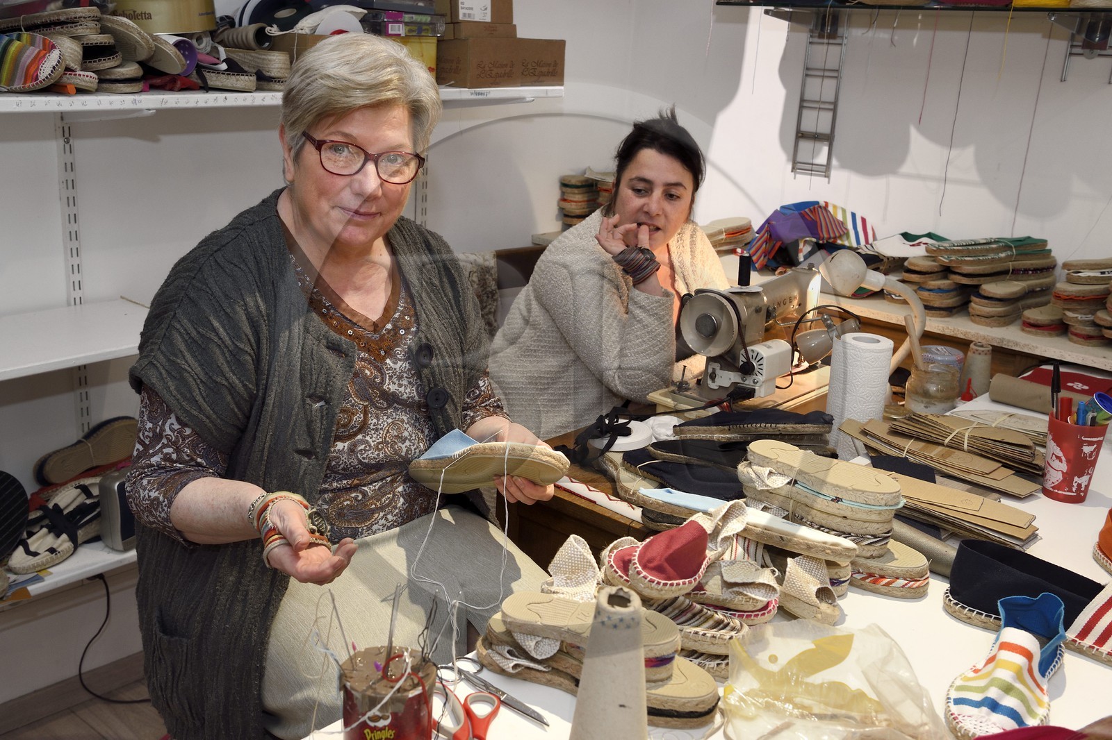 France, Pyrenees Atlantiques, Basque Country, Saint Jean Pied de Port, Albertine Arangois and her daughter Patricia in their shop and craft factory of espadrilles