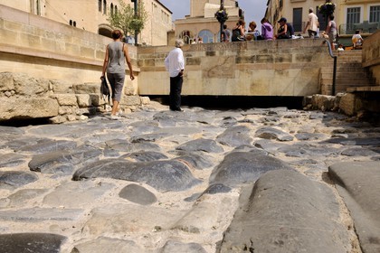 France, Aude, Narbonne, Place de l'Hotel de Ville, remains of the Via Domitia at the bottom of Palais des Archeveques (the Archbishops Palace)