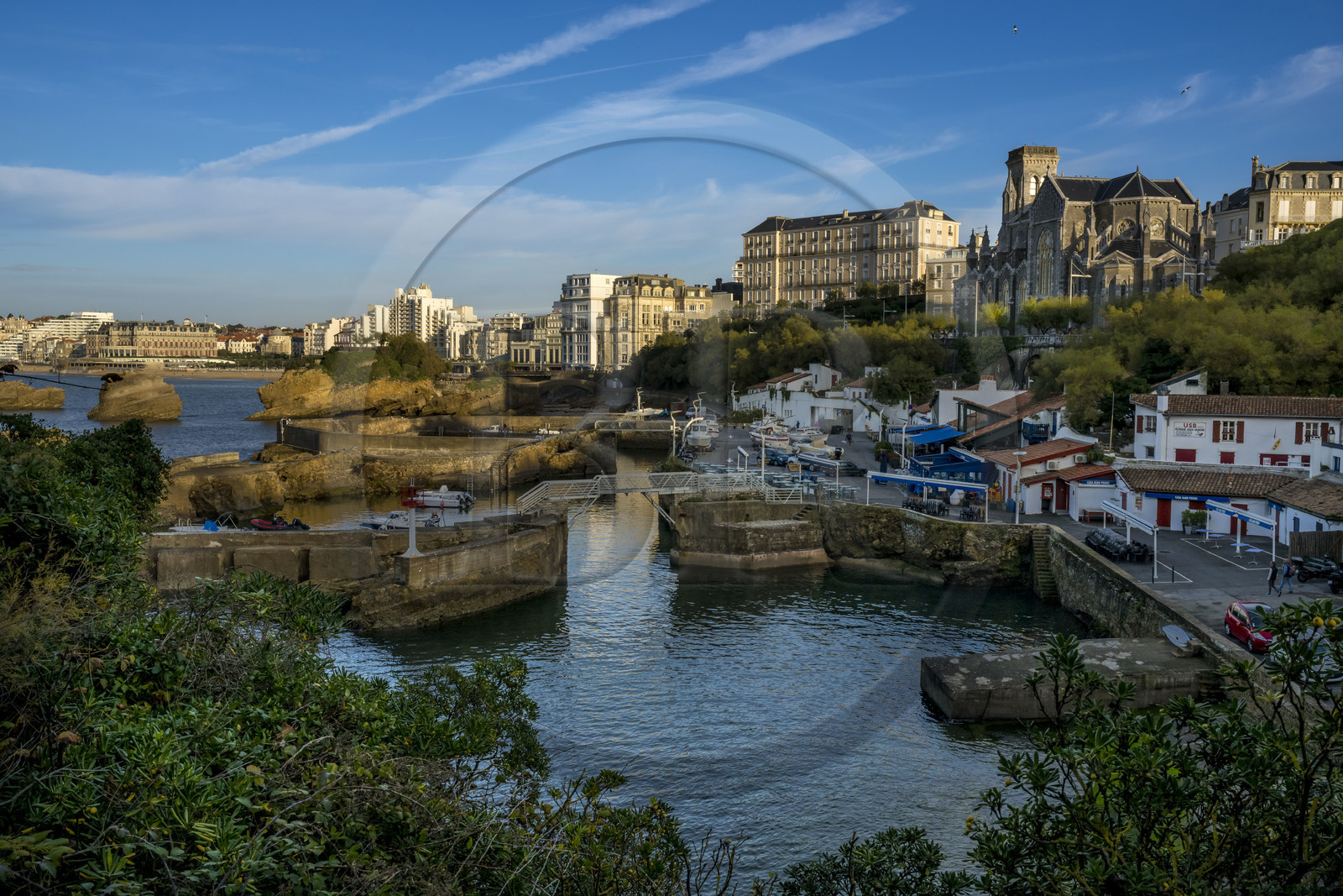 France, Pyrenees Atlantiques, Basque Country, Biarritz, Port des Pecheurs, Sainte Eugenie church and facades of the buildings located on Grande Plage (Great beach)
