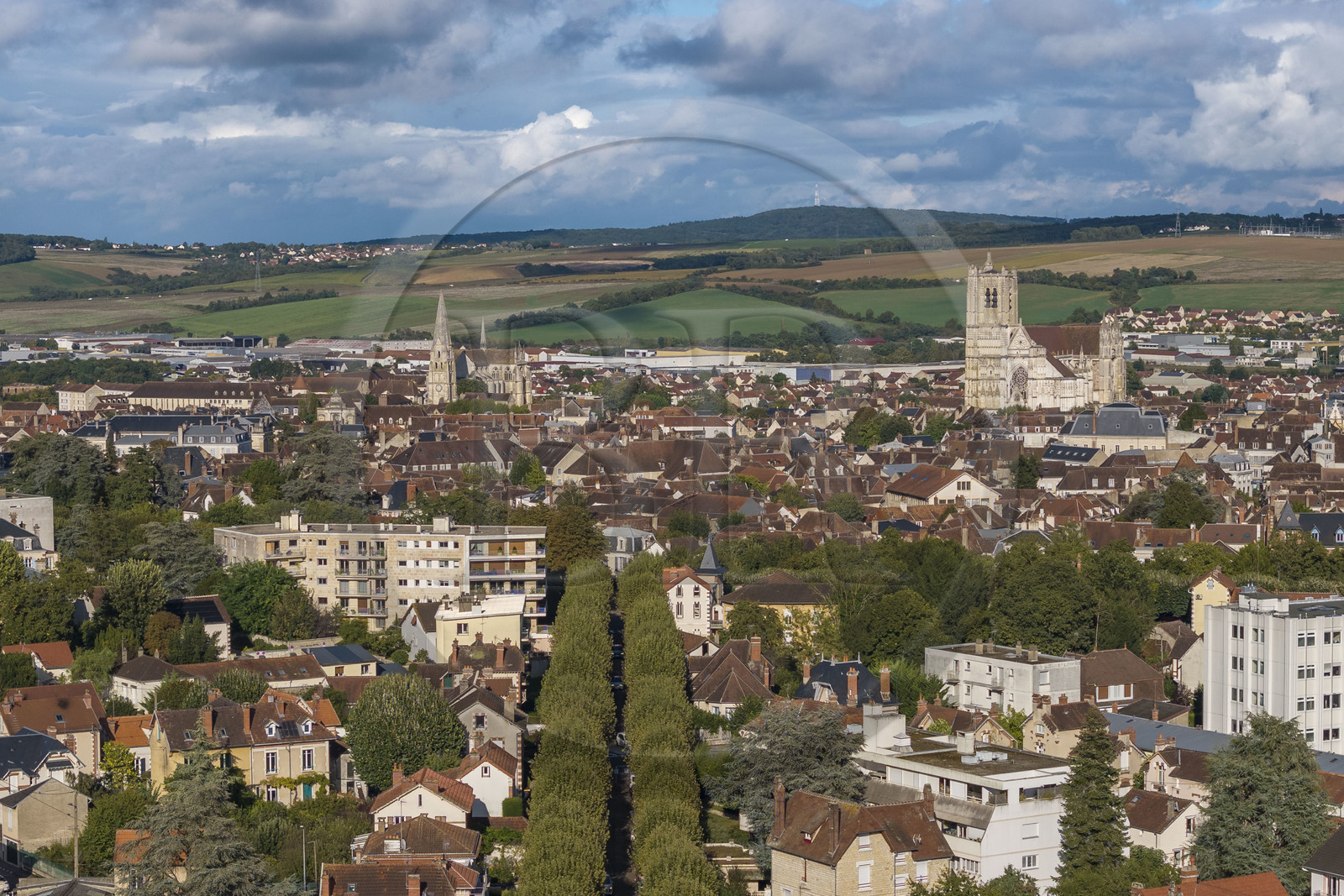 France, Yonne, Auxerre, Saint-Germain Abbey on the left and Saint Etienne Cathedral on the right, the hills surrounding the city in the background (aerial view)