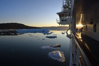Greenland, west coast, Disko Bay, Hurtigruten's MS Fram Cruise Ship moves between Icebergs in Quervain Bay