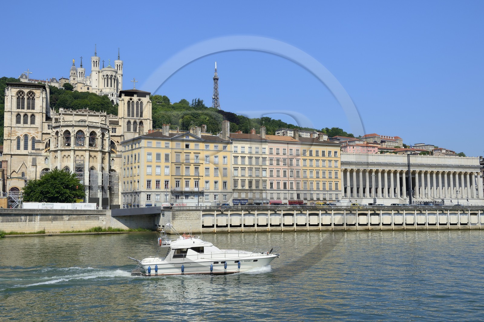 France, Rhone, Lyon, historical site listed as World Heritage by UNESCO, Vieux Lyon (Old Town), Saint Jean Cathedral (Saint John's Cathedral) and the courthouse on the Saone river, Notre Dame de Fourviere in the background