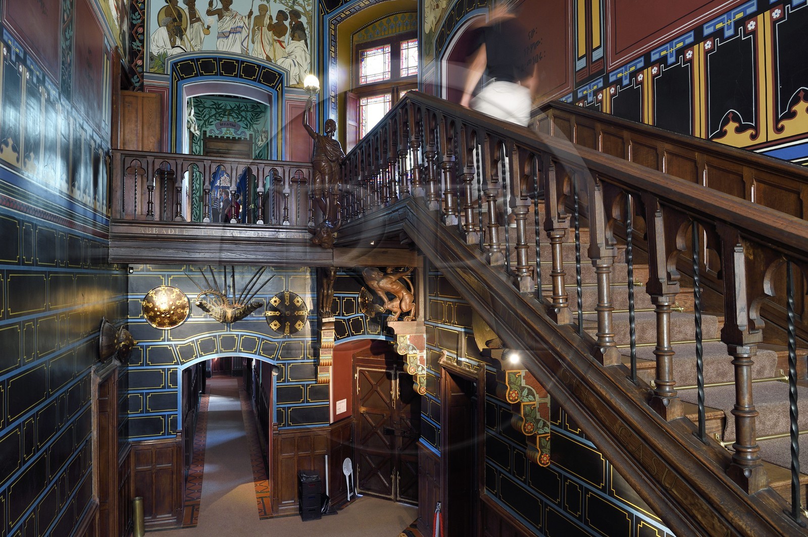 France, Pyrenees Atlantiques, Basque Country coast, Hendaye, Abbadia castle built in 1870 by Eugène Viollet-le-Duc for Antoine d'Abbadie d'Arrast, the Ethiopian paintings of the vestibule and the grand staircase, torchiere lamp statue representing Abdullah former Ethiopian slave freed and dead under the commune of Paris