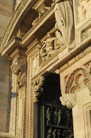 Italy, Lombardy, Milan, the Duomo in the historical center, cathedral in Gothic Flamboyant style, left portal