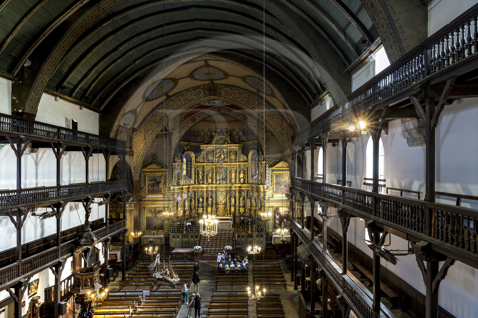 France, Pyrenees Atlantiques, Basque Country, Saint Jean de Luz, the Saint-Jean-Baptiste (Saint John the Baptist) Church, 17th century altarpiece in gilded wood and the wooden galleries of the nave